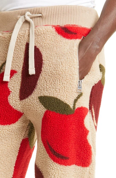 Shop Jw Anderson Apple Print Fleece Joggers In Beige/ Red