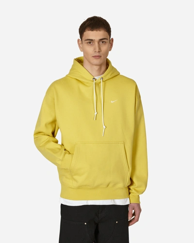 Shop Nike Solo Swoosh Hooded Sweatshirt Yellow In Multicolor