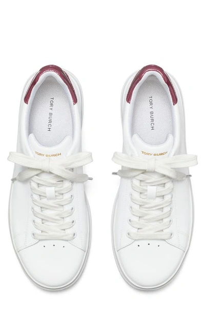 Shop Tory Burch Howell Court Sneaker In Titanium White/vintage Eggplnt