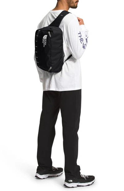 Shop The North Face Base Camp Voyager Sling Backpack In Black/ White