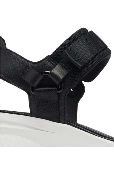 Shop Sorel Kinetic™ Y-strap Sandal In Black/ Sea Salt