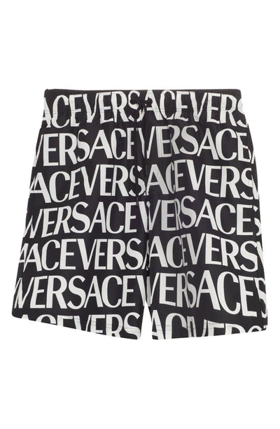 Shop Versace Logo Print Swim Trunks In Black/ White