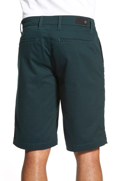 Shop Ag Green Label 'the Canyon' Flat Front Performance Shorts In Scots Pine