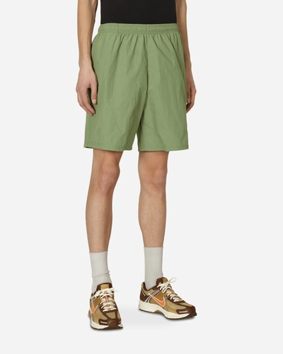 Shop Nike Solo Swoosh Woven Shorts Green In Multicolor