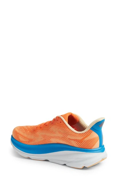 Shop Hoka Clifton 9 Running Shoe In Vibrant Orange / Impala