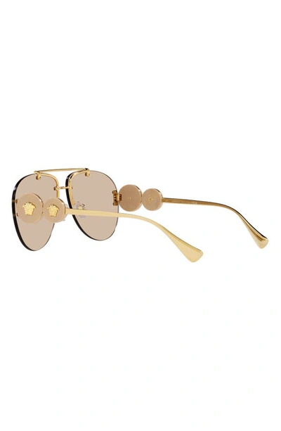Shop Versace 63mm Aviator Sunglasses In Light Brown