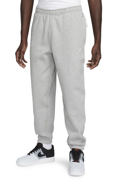 Shop Nike Solo Swoosh Fleece Sweatpants In Dark Grey Heather/ White