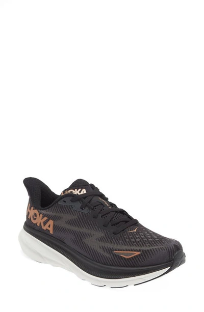 Shop Hoka Clifton 9 Running Shoe In Black / Copper