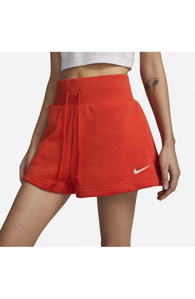 Shop Nike Phoenix Fleece Knit Shorts In Picante Red/ Sail