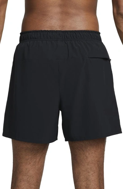 Shop Nike Dri-fit Unlimited 5-inch Athletic Shorts In Black/ Black/ Black