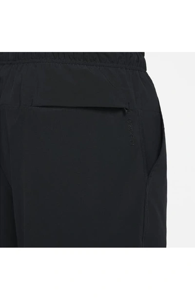 Shop Nike Dri-fit Unlimited 5-inch Athletic Shorts In Black/ Black/ Black