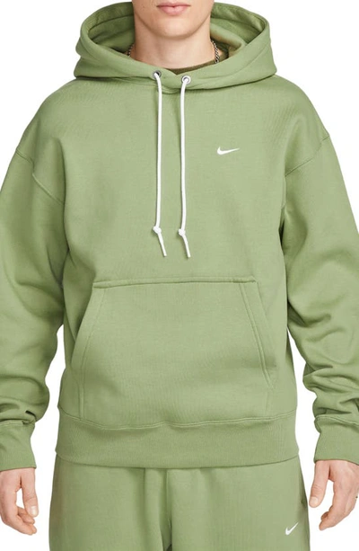 Shop Nike Solo Swoosh Fleece Hoodie In Oil Green/ White