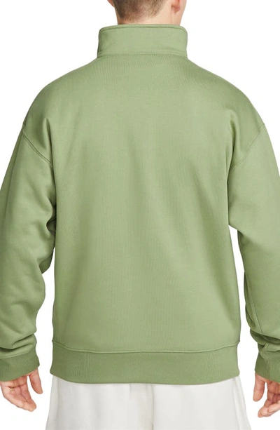 Shop Nike Solo Swoosh Oversize Quarter Zip Sweatshirt In Oil Green/ White