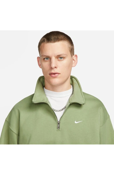 Shop Nike Solo Swoosh Oversize Quarter Zip Sweatshirt In Oil Green/ White