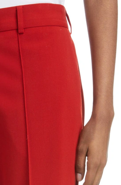 Shop Acne Studios Pinna Pleated Cuff Gabardine Trousers In Red