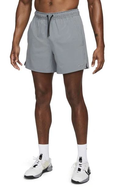 Shop Nike Dri-fit Unlimited 5-inch Athletic Shorts In Smoke Grey/ Black/ Smoke Grey