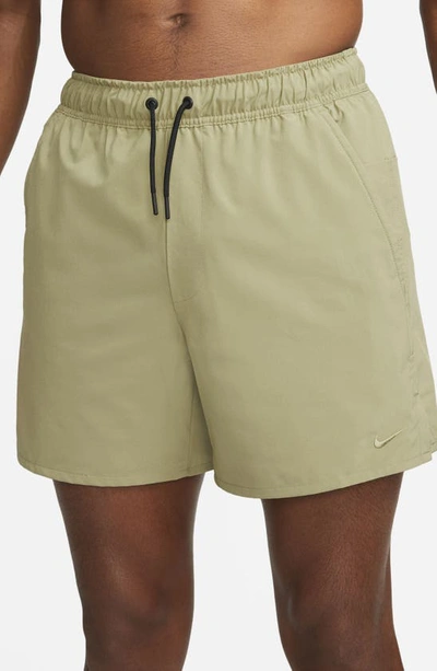 Shop Nike Dri-fit Unlimited 5-inch Athletic Shorts In Neutral Olive/ Black
