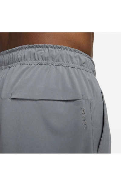 Shop Nike Dri-fit Unlimited 5-inch Athletic Shorts In Smoke Grey/ Black/ Smoke Grey