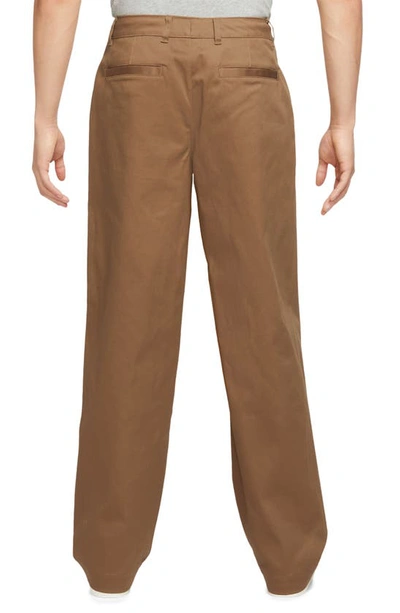 Shop Nike Life Stretch Cotton Chino Pants In Ale Brown/ White