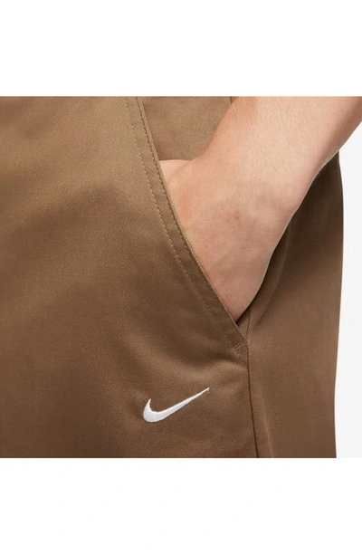 Shop Nike Life Stretch Cotton Chino Pants In Ale Brown/ White