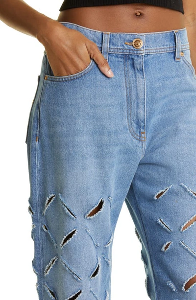 Shop Versace Laser Cutout Rigid Jeans In Blue