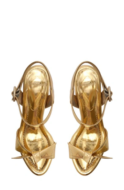 Shop Alexandre Birman Clarita Flare Metallic Leather Sandal In Golden