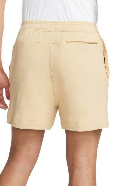 Shop Nike French Terry Shorts In Sesame/ Safety Orange