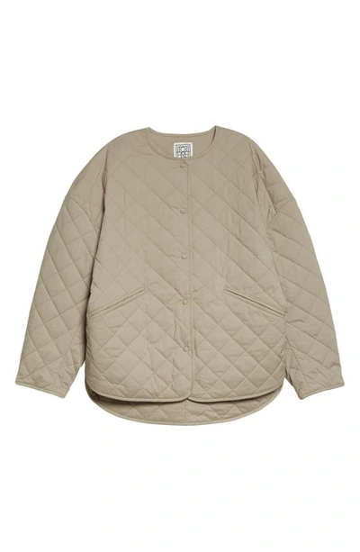 Shop Totême Boxy Organic Cotton Quilted Jacket In Wet Sand