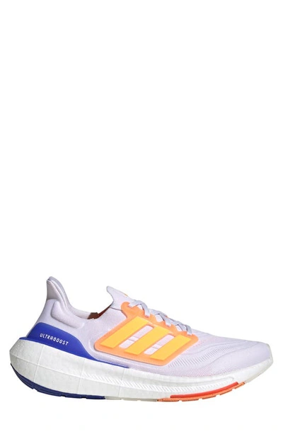Shop Adidas Originals Ultraboost 23 Running Shoe In White/ Solar Gold/ Lucid Blue