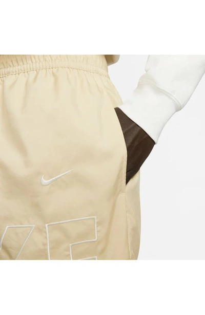Shop Nike Sportswear Flow Shorts In Team Gold