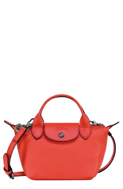 Shop Longchamp Extra Small Le Pliage Leather Top Handle Bag In Orange