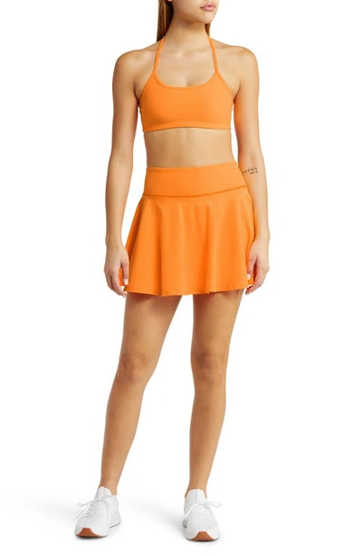 Shop Beyond Yoga Hot Shot Spacedye Skirt In Mango Pop Heather