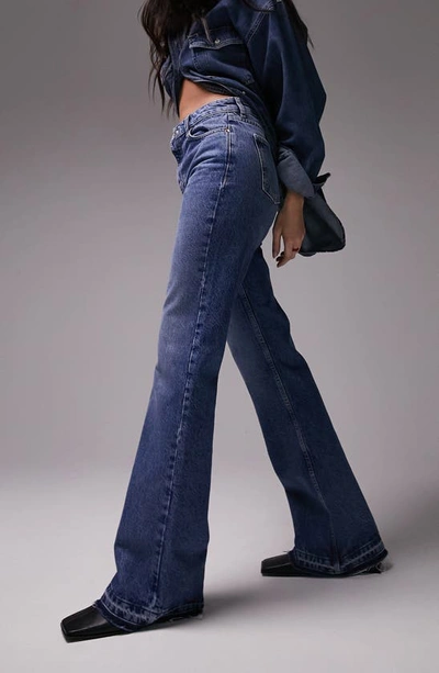 Shop Topshop '90s Let Down Hem Flare Jeans In Medium Blue