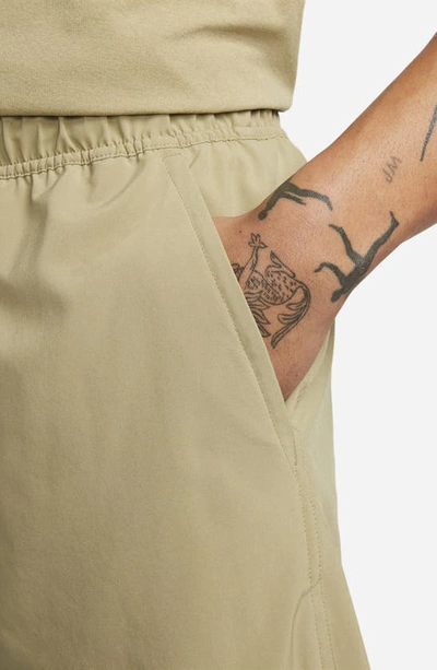 Nike Men's Unlimited Dri-fit 9" Unlined Versatile Shorts In Olive/ Black/ Neutral Olive