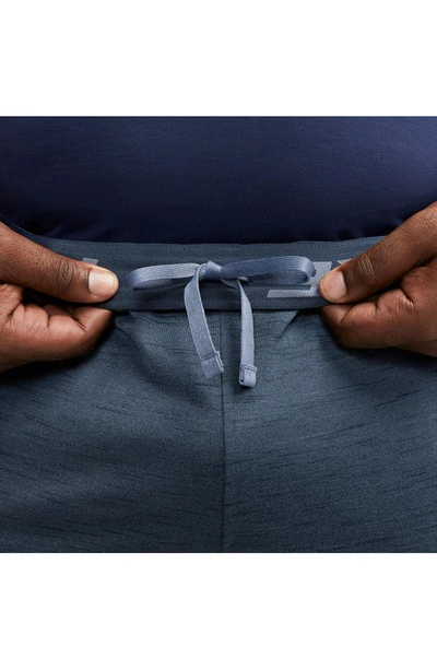 Shop Nike Pocket Yoga Pants In Diffused Blue/ Obsidian