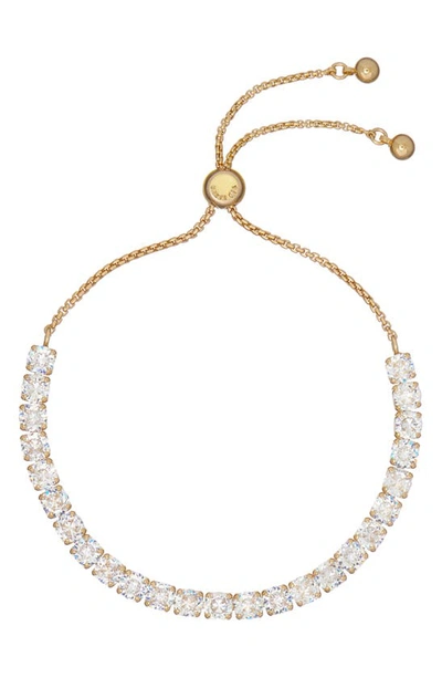 Shop Ted Baker Melrah Icon Crystal Slider Tennis Bracelet In Gold Tone Clear Crystal