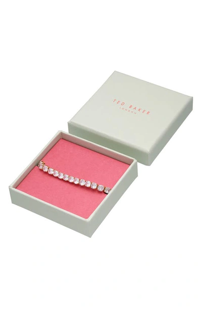 Shop Ted Baker Melrah Icon Crystal Slider Tennis Bracelet In Gold Tone Clear Crystal