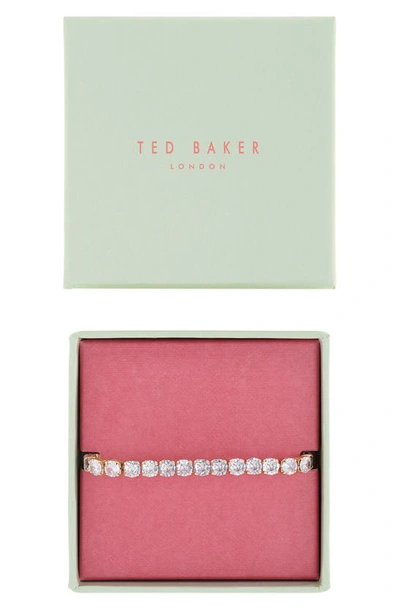 Shop Ted Baker Melrah Icon Crystal Slider Tennis Bracelet In Gold Tone Clear Crystal