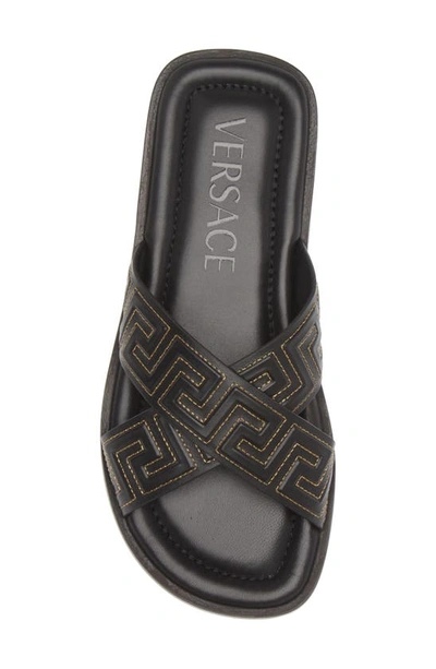 Shop Versace La Greca Leather Slide Sandal In Black/ Gold