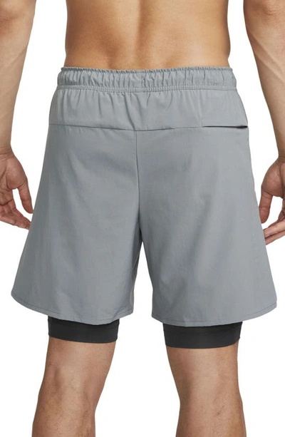 Shop Nike Dri-fit Unlimited 2-in-1 Versatile Shorts In Dark Smoke Grey/ Black