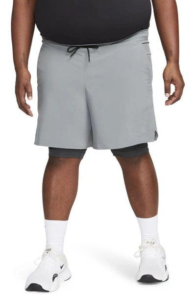 Shop Nike Dri-fit Unlimited 2-in-1 Versatile Shorts In Dark Smoke Grey/ Black