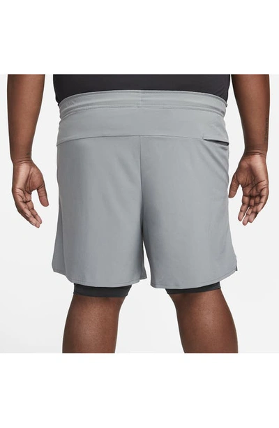 Shop Nike Dri-fit Unlimited 2-in-1 Versatile Shorts In Dark Smoke Grey/ Black