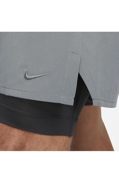 Shop Nike Dri-fit Unlimited 2-in-1 Versatile Shorts In Dark Smoke Grey/ Black