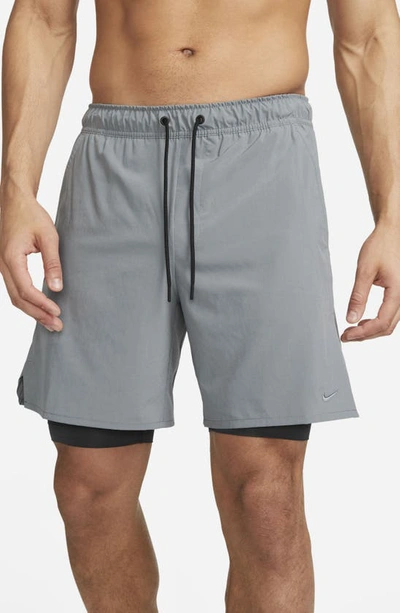 Shop Nike Dri-fit Unlimited 2-in-1 Versatile Shorts In Dark Smoke Grey/ Black