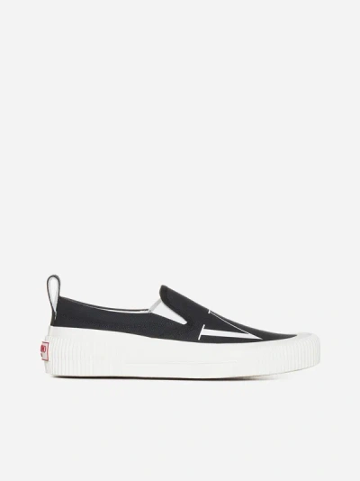 Shop Valentino Vltn Canvas Slip-on Sneakers In Black,white