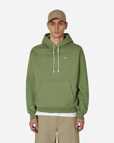 Shop Nike Solo Swoosh Hooded Sweatshirt Green In Multicolor