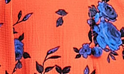 Shop Asos Design Floral Puff Sleeve Jumpsuit In Orange Multi
