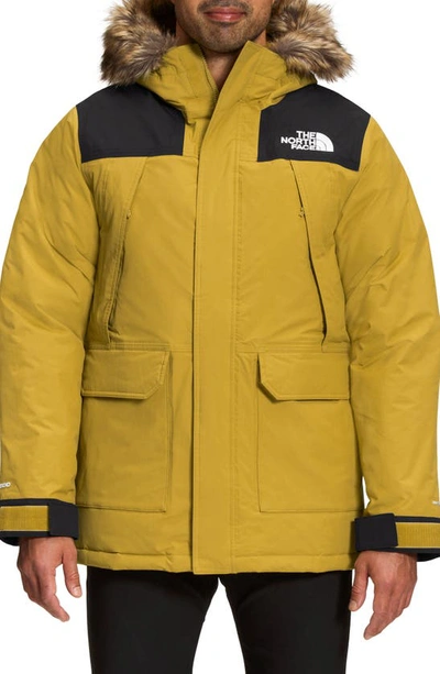 Shop The North Face Mcmurdo Waterproof 600 Fill Power Hooded Down Parka With Faux Fur Trim In Mineral Gold/ Black