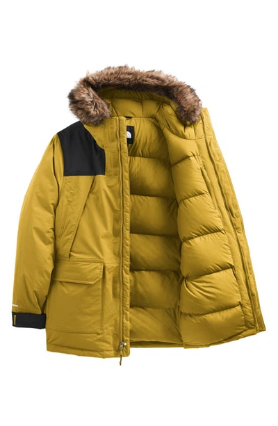 Shop The North Face Mcmurdo Waterproof 600 Fill Power Hooded Down Parka With Faux Fur Trim In Mineral Gold/ Black