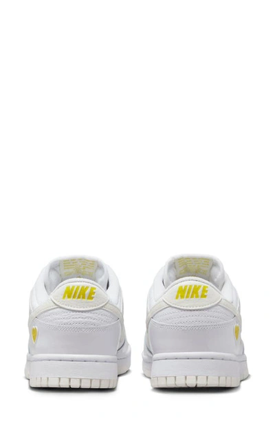 Shop Nike Dunk Low Basketball Shoe In White/ Sail/ Opti Yellow